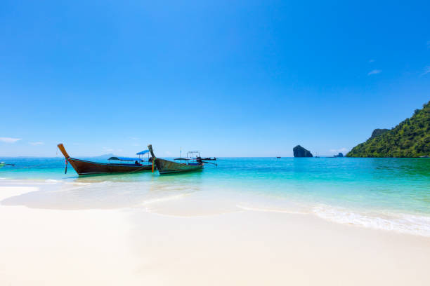 istock Longtail Boats Moored At Aonang Beach Against Blue Sky 1020544634