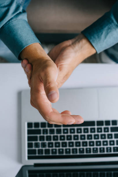 istock close-up partial view of man suffering from pain in wrist while using laptop 1020548300