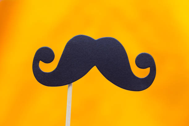 istock Photo booth props black Mustache against yellow background 1020553848