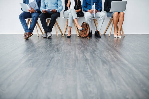 Who will be hired? Cropped studio shot of a group of diverse businesspeople waiting in line hireage stock pictures, royalty-free photos & images