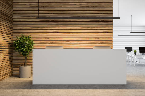 istock White reception table in a wooden wall office 1020559214