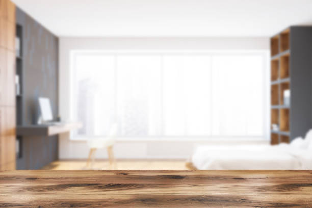 istock White bed panoramic bedroom and home office blur 1020559378