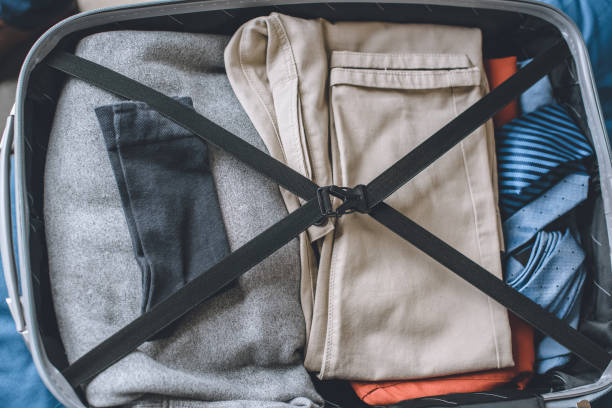 istock elevated view of clothes in traveler suitcase 1020563206