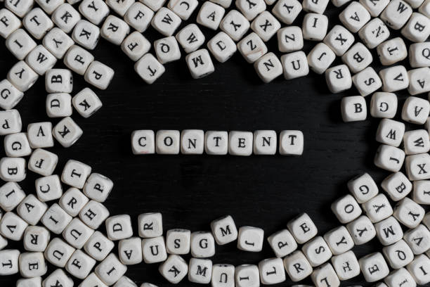Word  on wooden cubes on a black wooden table with copy space