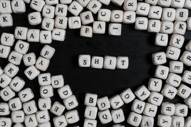 istock Word  on wooden cubes on a black wooden table with copy space 1020567366