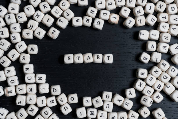 istock Word  on wooden cubes on a black wooden table with copy space 1020568206
