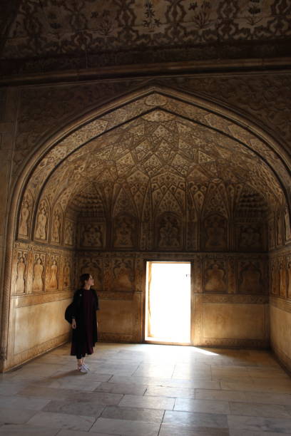 istock woman travelling in a marble temple 1020573668