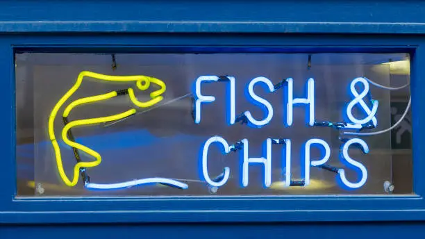 Photo of Illuminated Fish and Chips Sign