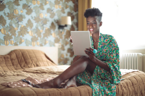 istock Young woman is browsing the internet at home 1020585428