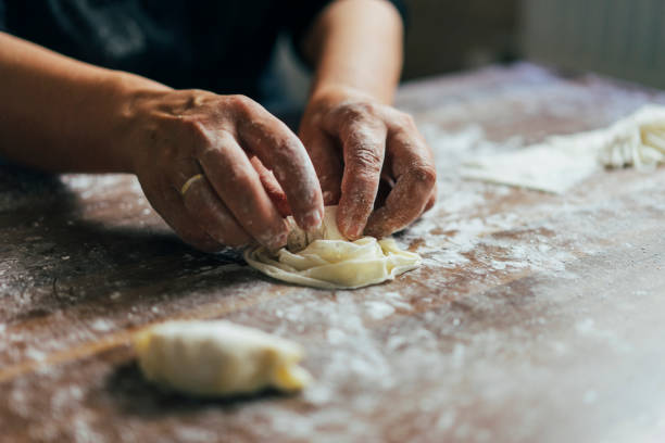 istock Close-up of hands kneading dough 1020586002