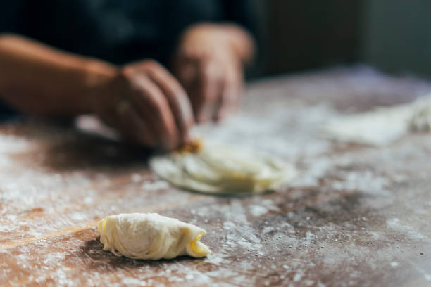 istock Close-up of hands kneading dough 1020586126