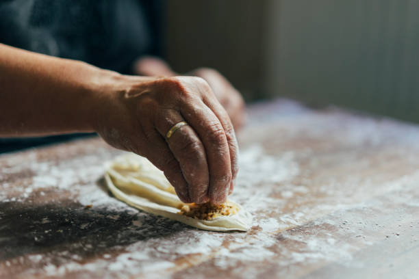 istock Close-up of hands kneading dough 1020586156