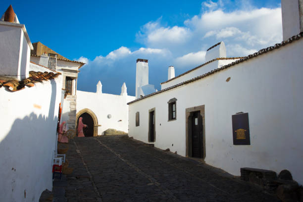 istock old portuguese street with white wall 1020586214