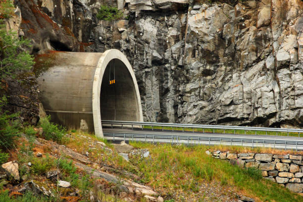 istock Road entering the tunnel, Norway 1020591940