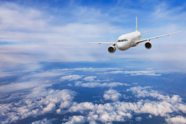 istock airplane flying above the clouds, travel 1020605816