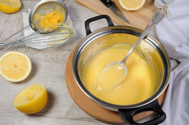 istock Freshly prepared lemon kurd - custard on fruit juice, in a saucepan stir with a spoon 1020608394