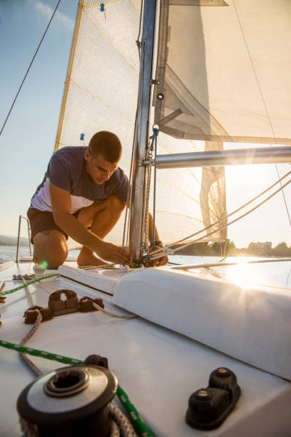 istock Young man on the sailboat. 1020608520