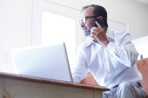 istock Latino Businessman Sitting In Front Of Laptop While Working From Home Office 1020614072