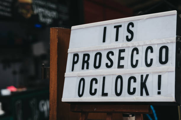 "It's prosecco o'clock" black and white sign. stock photo
