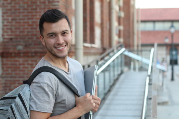 istock Handsome joyful mixed race person heading to school 1020621392