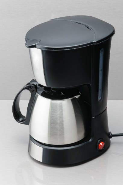 istock Coffee machine with pot on the grey mirror background. 1020643440
