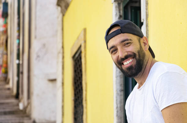 istock Portrait of a spanish man with snapback hat looking camera. 1020644196