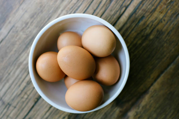 istock Farm Fresh Eggs in a Bowl on a Farm Table 1020644542