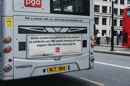 London, UK - July 24, 2018: Close up of a message on the platinum Arriva bus on a street in London, celebrating its staff that donate to charity. Arriva is a bus company operating in Greater London.