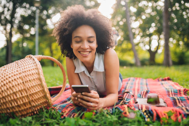 istock Young beautiful woman looking at mobile phone 1020675170
