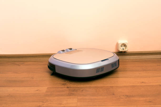 istock Modern robotic vacuum cleaner in the room 1020679362