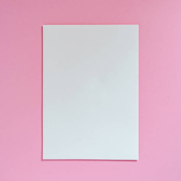 istock Sheet of white paper on a pink background 1020683276