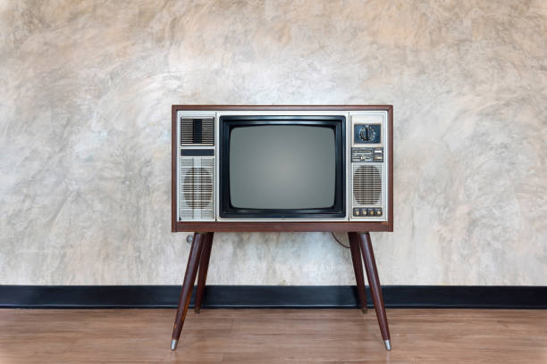 istock Vintage Television Set On Floor Against Wall 1020686942