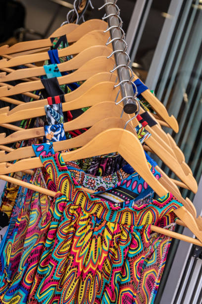 istock Multi Colored Clothes Hanging At Market For Sale 1020692254