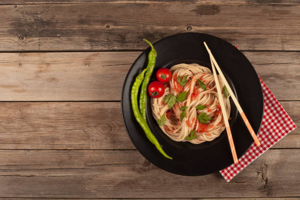 istock spaghetti bowl over wooden table 1020692814