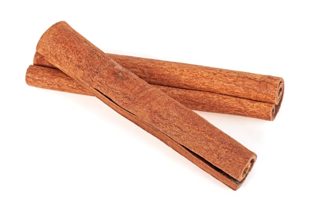 istock Pair of cinnamon sticks on a white background 1020693226