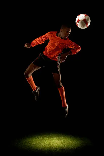 Photo of Footballer heading ball