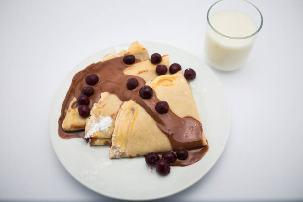 istock Plate of crepes with cherry and chocolate 1020698322