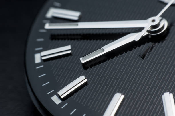 istock Close up clockwise on black clock face background. Wristwatch in retro style 1020706174