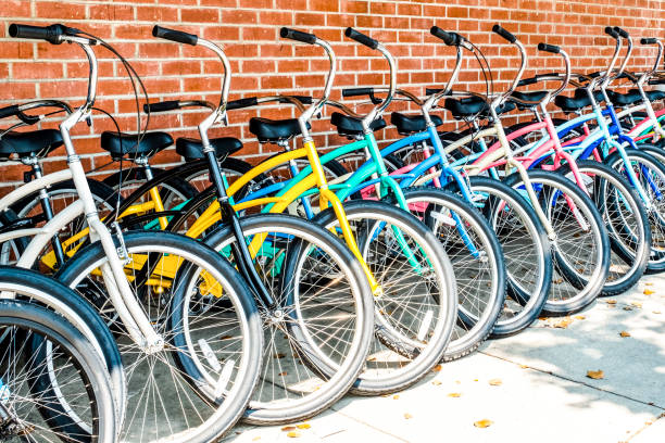 Group of bicycles in a row on sidewalk stock photo