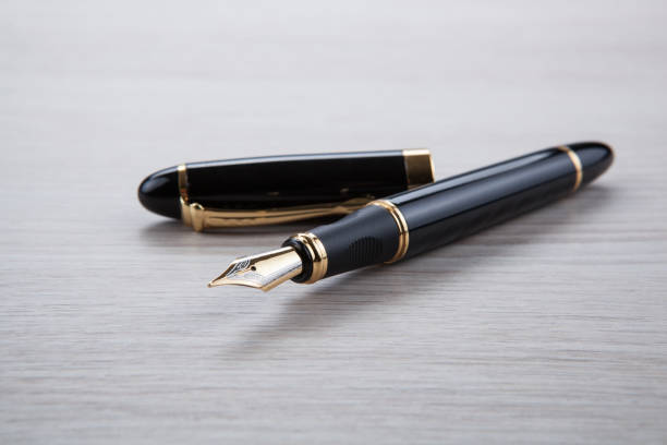 istock fountain pen on the gray desktop close up 1020706930