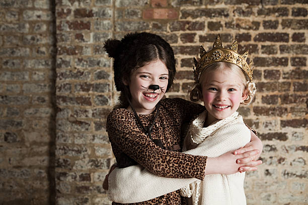 Young girls dressed up as cat and queen  cat face paint stock pictures, royalty-free photos & images
