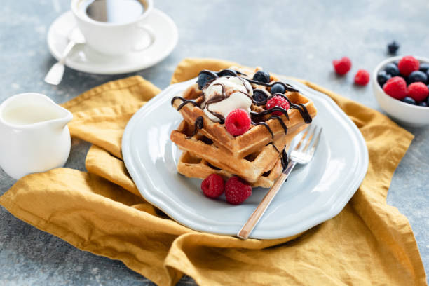 istock Belgian waffles with vanilla ice cream and berries 1020721012