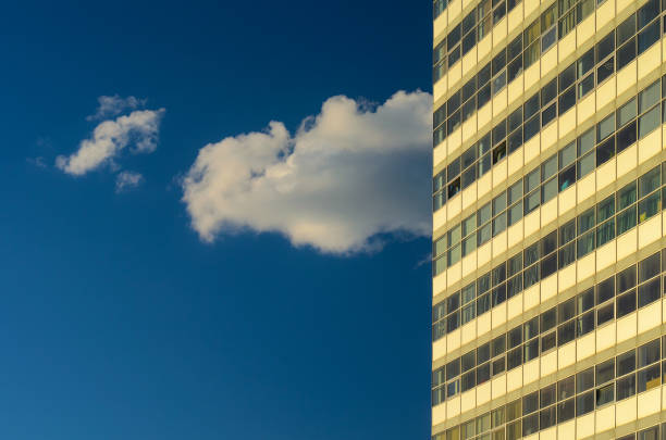 istock Multistorey Office Building and Cloud on Blue Sky 1020747564