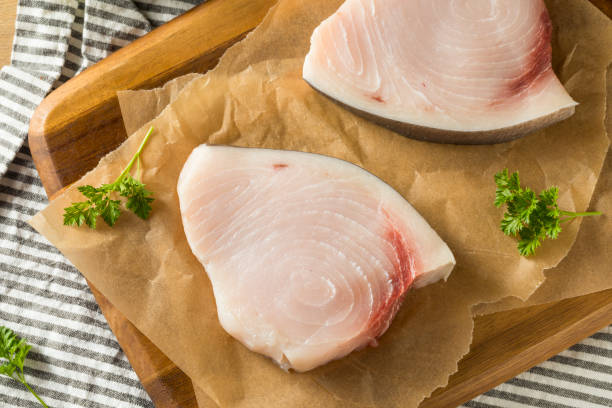 raw organic swordfish steak filets - swordfish imagens e fotografias de stock