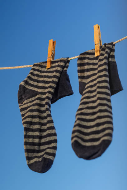istock Clothespins on a clothesline against a blue sky 1020752510