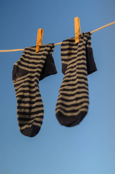 istock Clothespins on a clothesline against a blue sky 1020752546