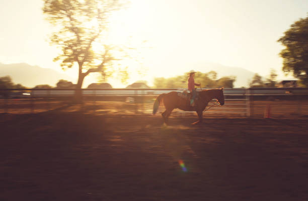istock Cowgirl ridding motion pano 1020752800