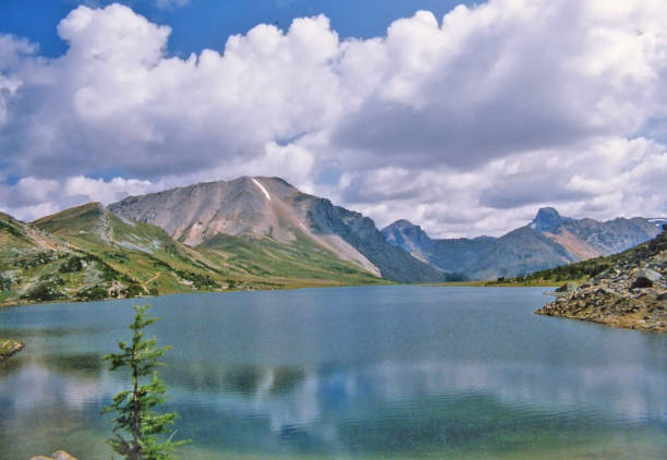 istock Mountain lake in summer with surrounding mountain peaks 1020752858