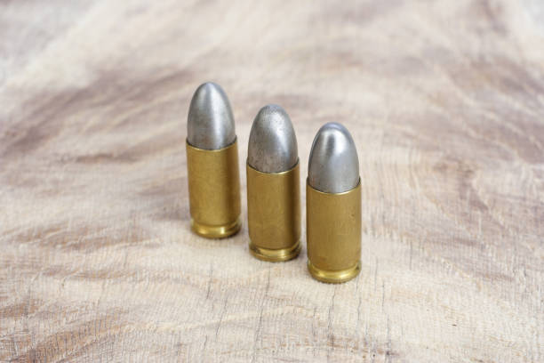 istock The 9mm caliber cartridge on wooden background 1020775000