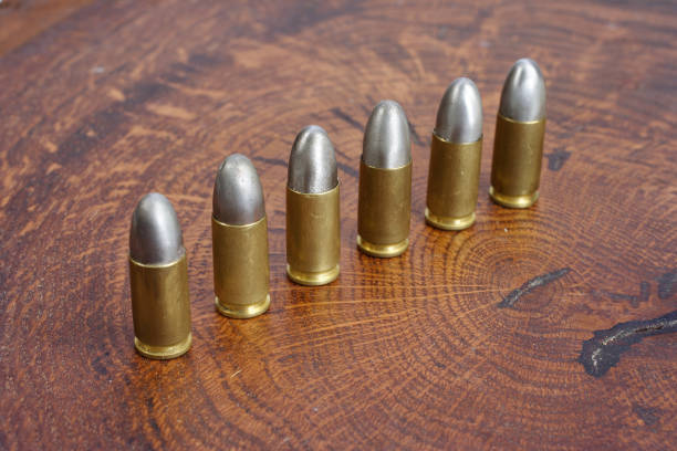 istock The 9mm caliber cartridge on wooden background 1020775026